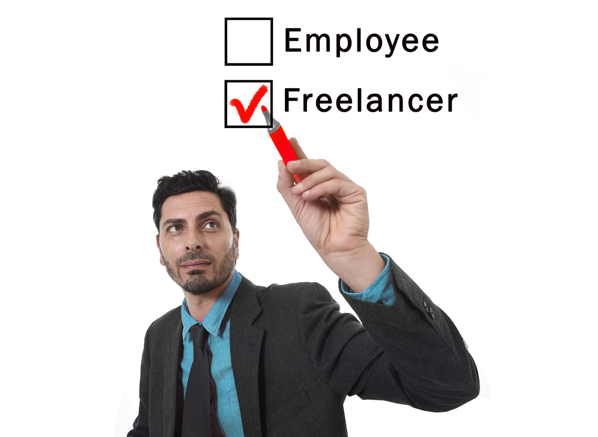 usinessman choosing freelancer to employee option ticking box with marker