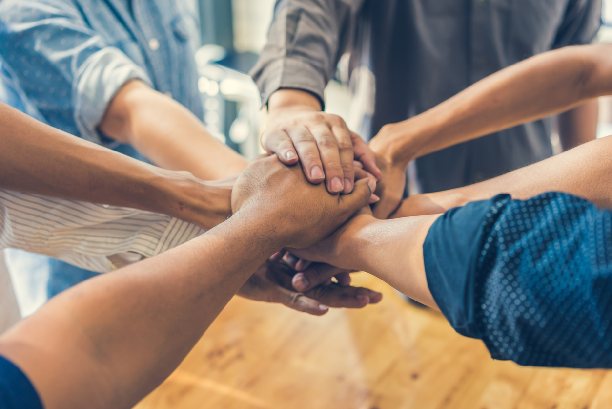 Business team participating in a business handshake