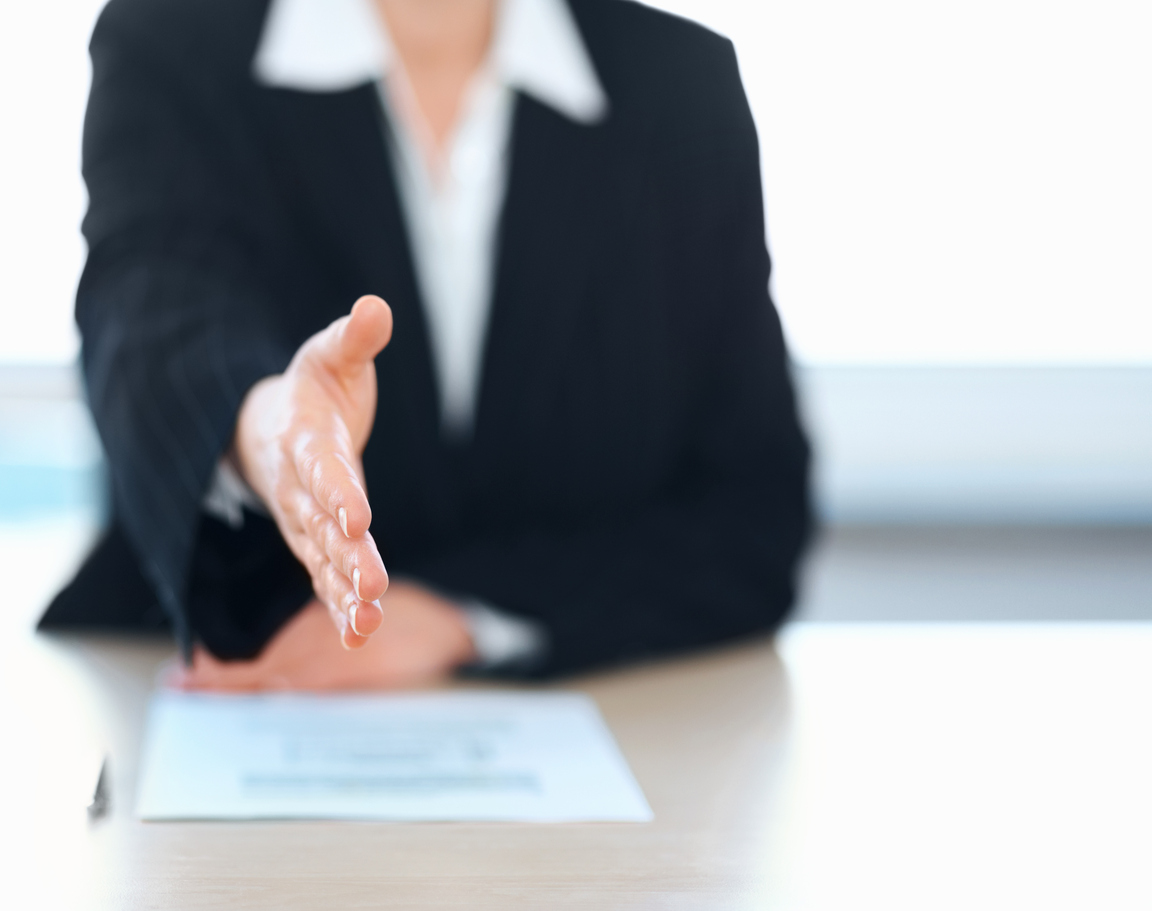 Temporary placement offering a handshake during interview