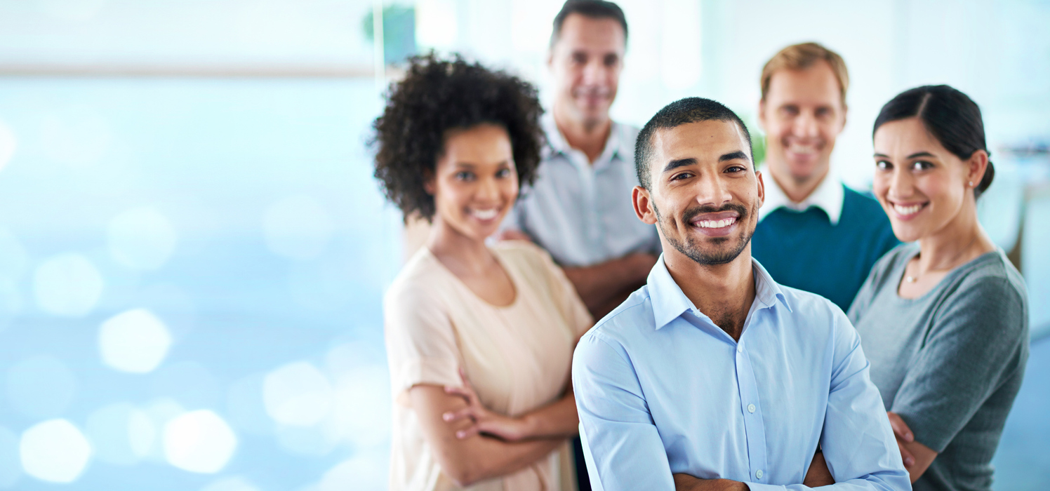 Cropped portrait of a group of diverse colleagues or temporary employees standing in their office against a digitally enhanced background