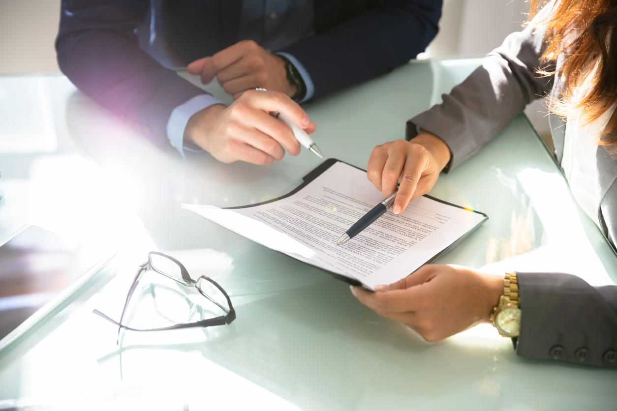 Interview showing close up of hands on a resume and top talent acquisition