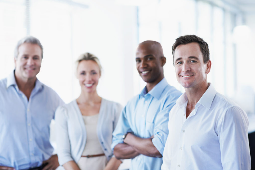 Portrait of a diverse group of smiling businesspeople in an staffing agency or recruitment office