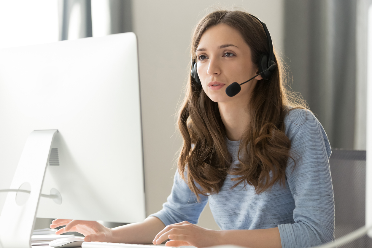 Temporary employee in wireless headset call center agent telemarketer consulting client participating business video conference talk help as customer care service support helpline in office
