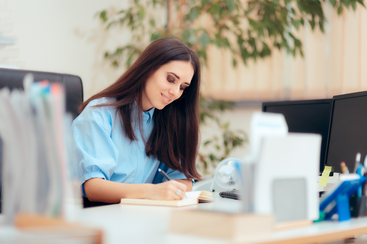 Busy woman having a desk job in corporate building from temp services
