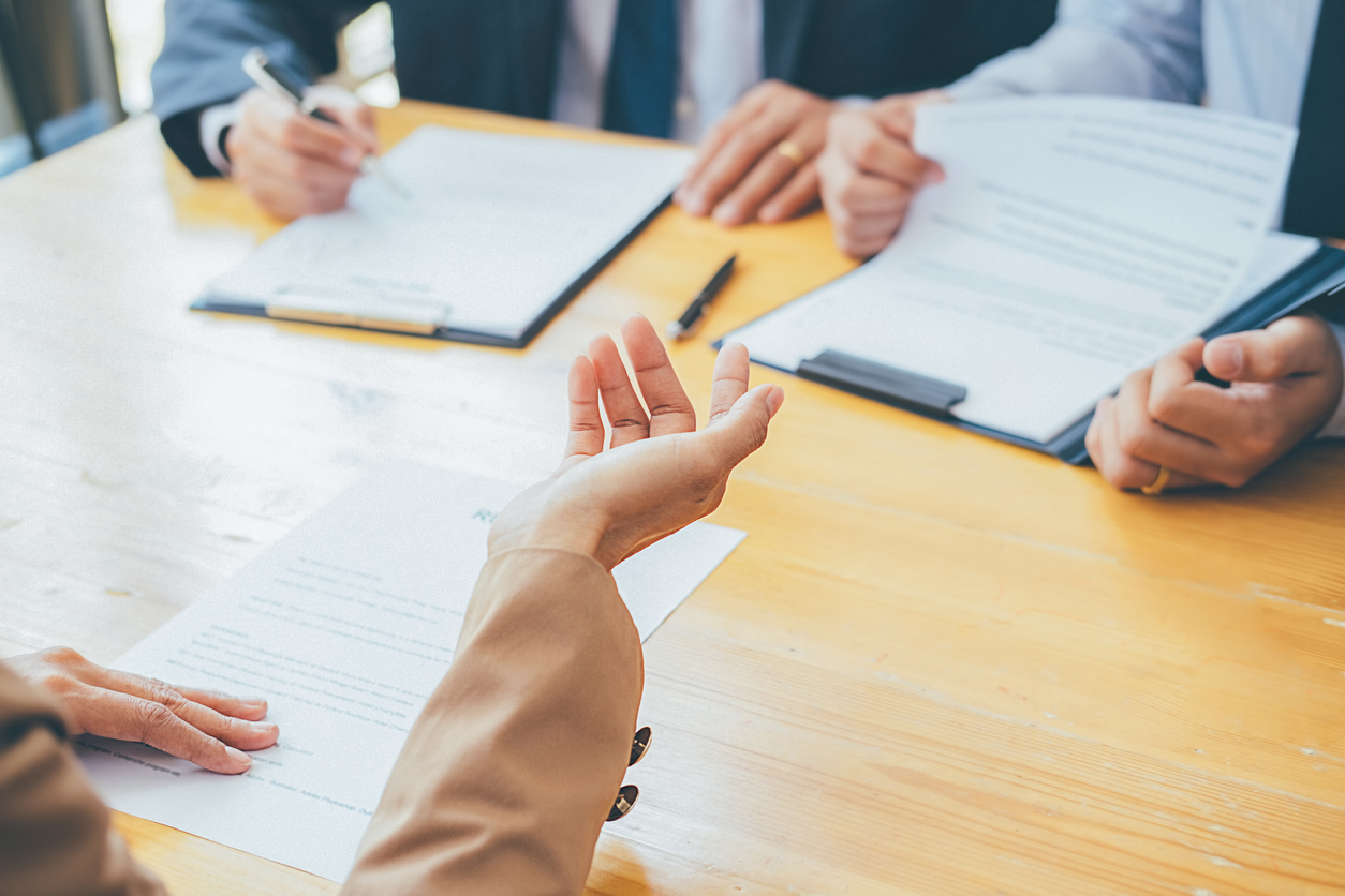 Attractive young business woman in a job interview for a temporary position with a profession staffing agency