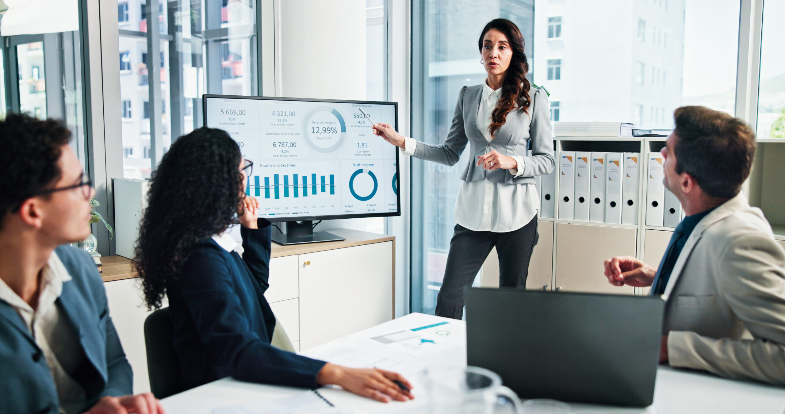 lady in front of a white board talking to a group