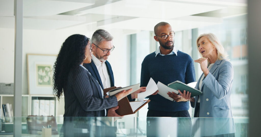Business, documents and people with meeting discussion for finance trends, policy decision or update
