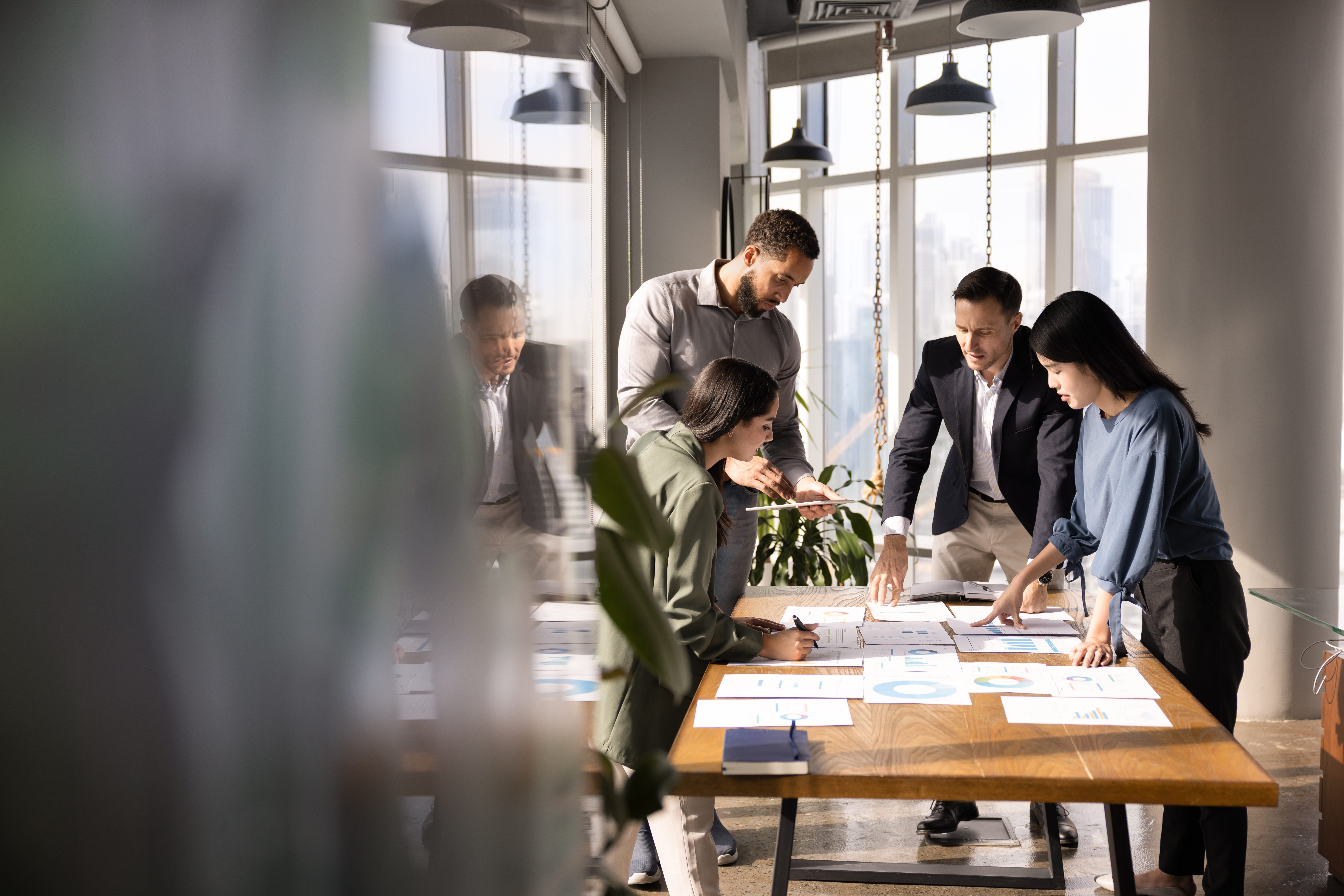 business people looking at documents on a table