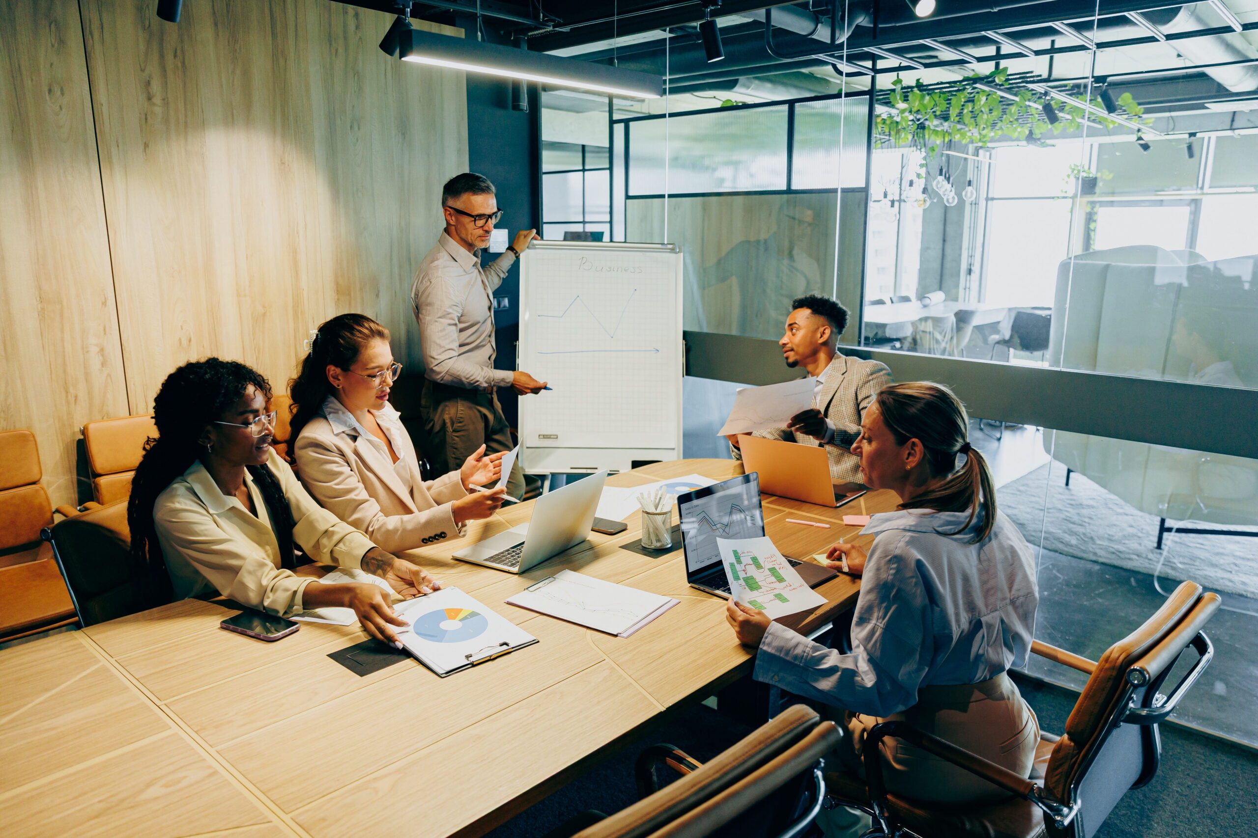 Conference room hosts negotiations between sales team and prospective buyer