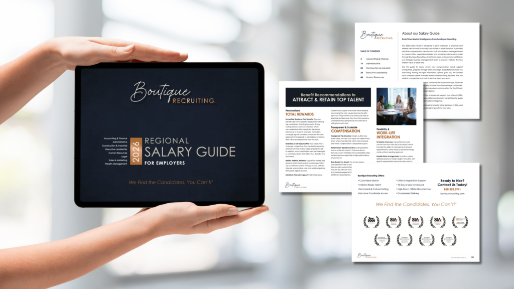 hand holding an ipad with boutique recruiting's salary guide